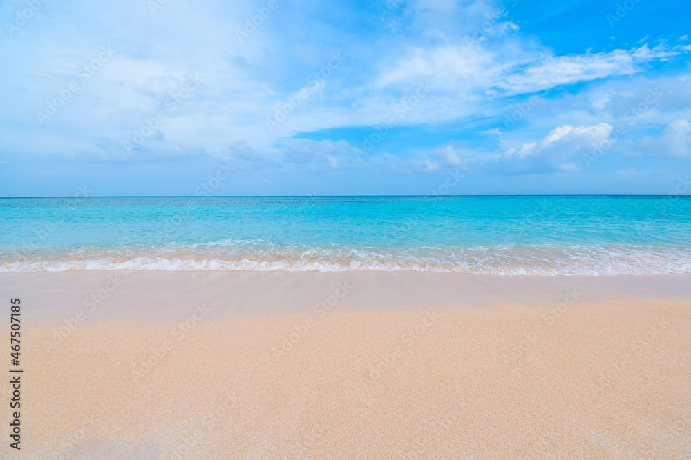 Beautiful tropical beach with clear blue sky and blue clear ocean at Hateruma Island, Okinawa, Japan. Great contrast of white smooth sands and blue ocean and blue sky