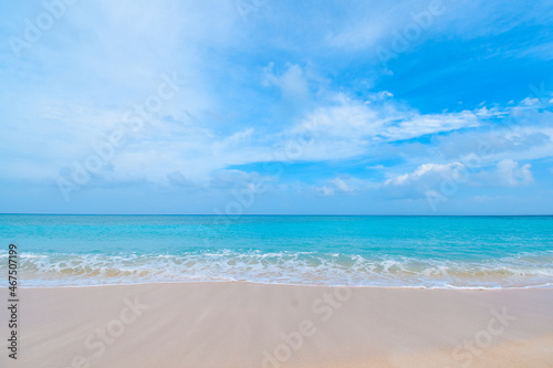 Beautiful tropical beach with clear blue sky and blue clear ocean at Hateruma Island, Okinawa, Japan. Very sunny day with nobody in the sight. Beach with waves © Kaori