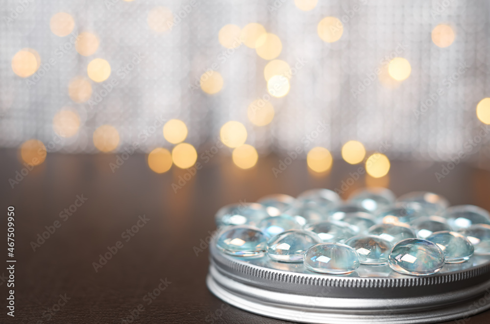 round podium with glass balls on a background of blurred lights