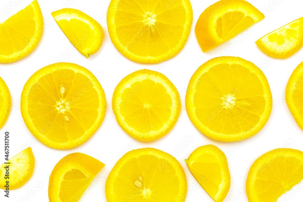 Four orange slices lie on a white background from the bottom edge of the photo