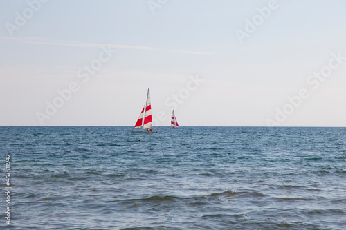 Two Windsurfing yachts on the horizon