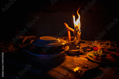 Dinner by candlelight during power outage in deep provinces, without electricity. Power crisis in many countries, climate changes and blackout concept