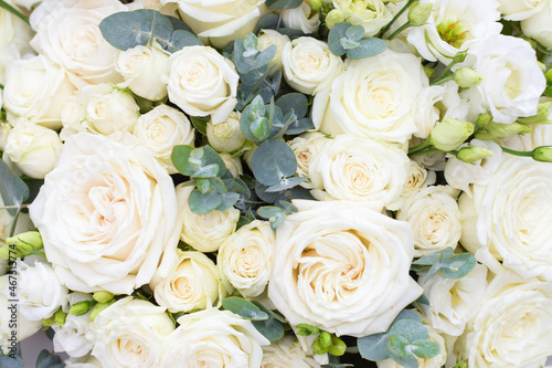 Floral background of white roses  eucalyptus  bouquet