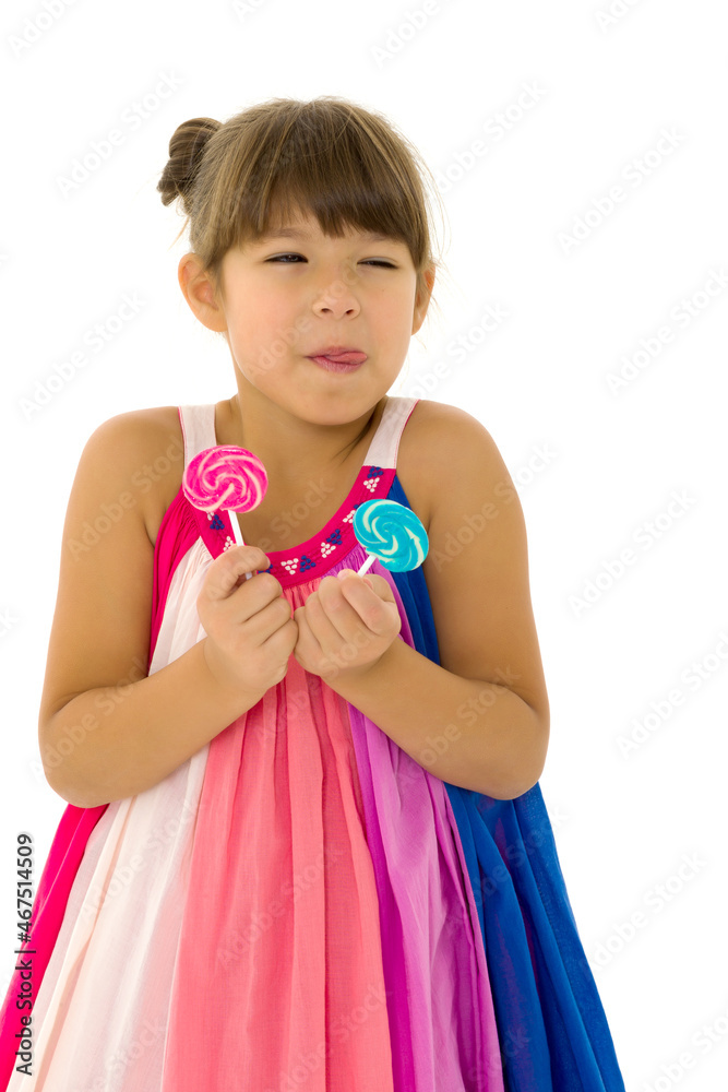 Portrait of cute preteen child having fun with lollipops Portrait of cute preteen child having fun with lollipops