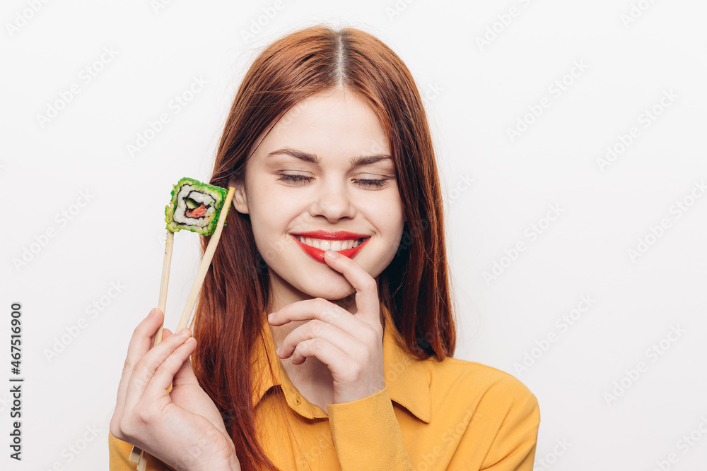 pretty woman eating sushi chopsticks light background pretty woman eating sushi chopsticks light background