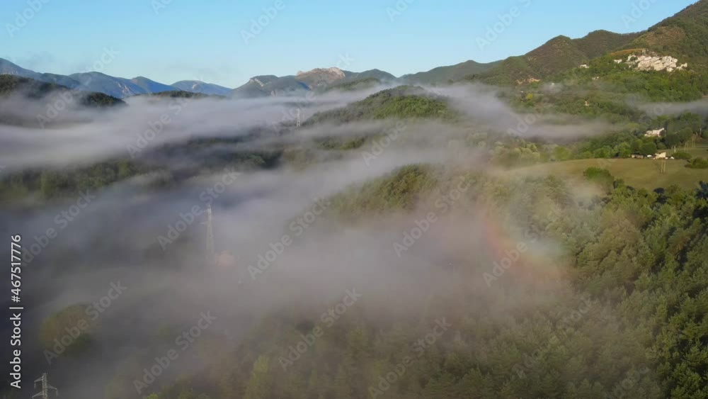 Flyover of clouds hovering just above forest at sunrise inParc naturel régional des Préalpes d'Azur Flyover of clouds hovering just above forest at sunrise inParc naturel régional des Préalpes d'Azur