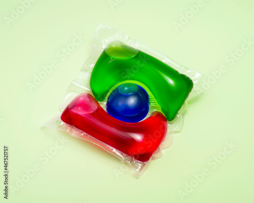 Liquid powder in gel capsule for washing multicolor on color background