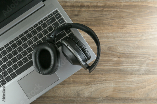 Black headphones on the laptop keyboard 