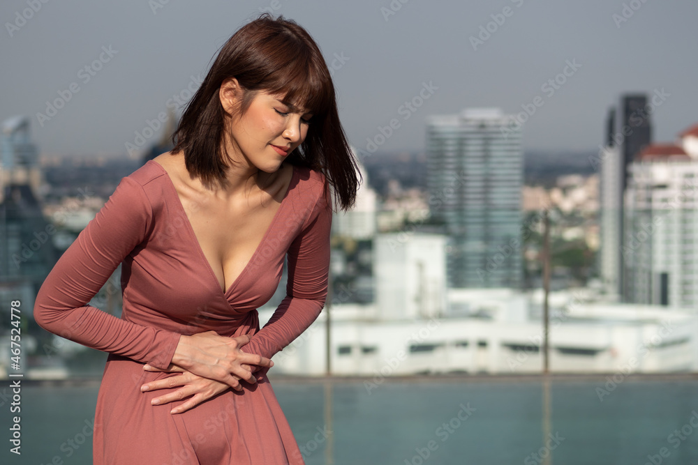 sick woman having stomachache or stomach sickness