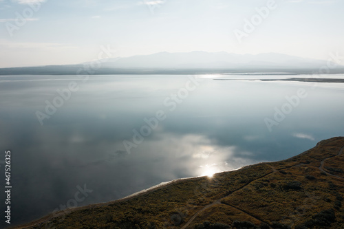 Pacific coastline, sunny summer day, road on the shore, horizontal lines