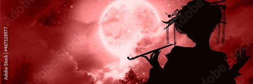 Foto Silhouette of a prostitutes of Yoshiwara brothel having smoke tube in front of creepy gold full moon