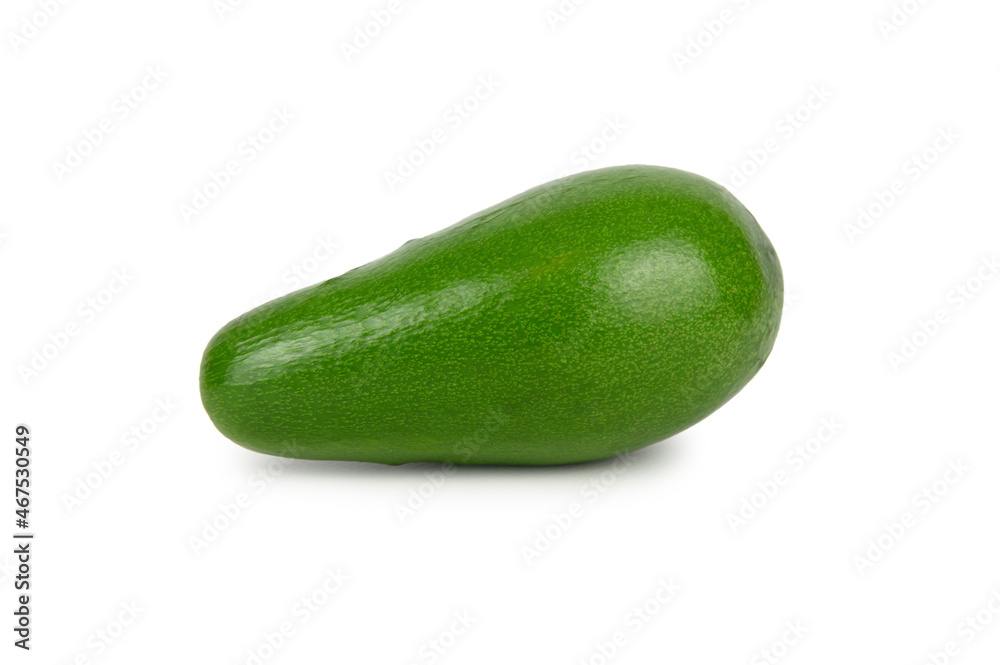 Avocado fruit with green skin and a slight shadow underneath Avocado fruit with green skin and a slight shadow underneath