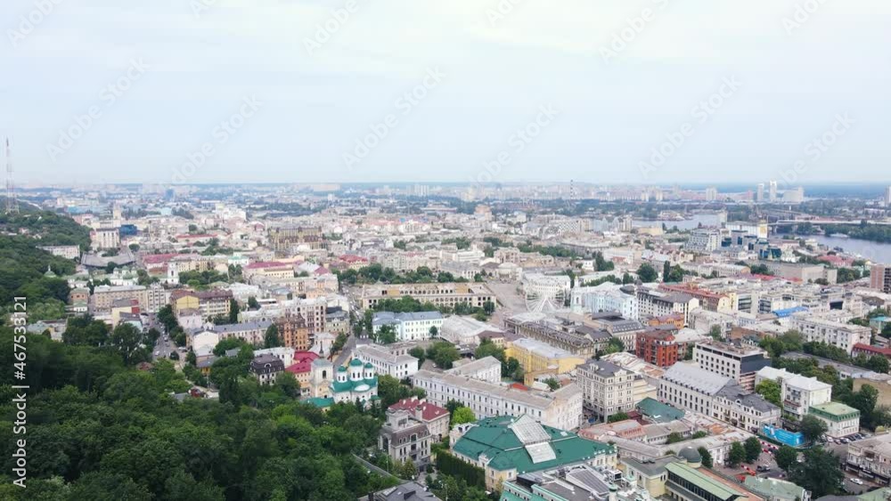 Flying over the buildings of the big city. Aerial view of the cityscape