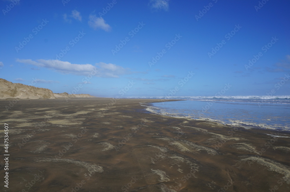 Yallow sand dunes in sunny day and blue sky