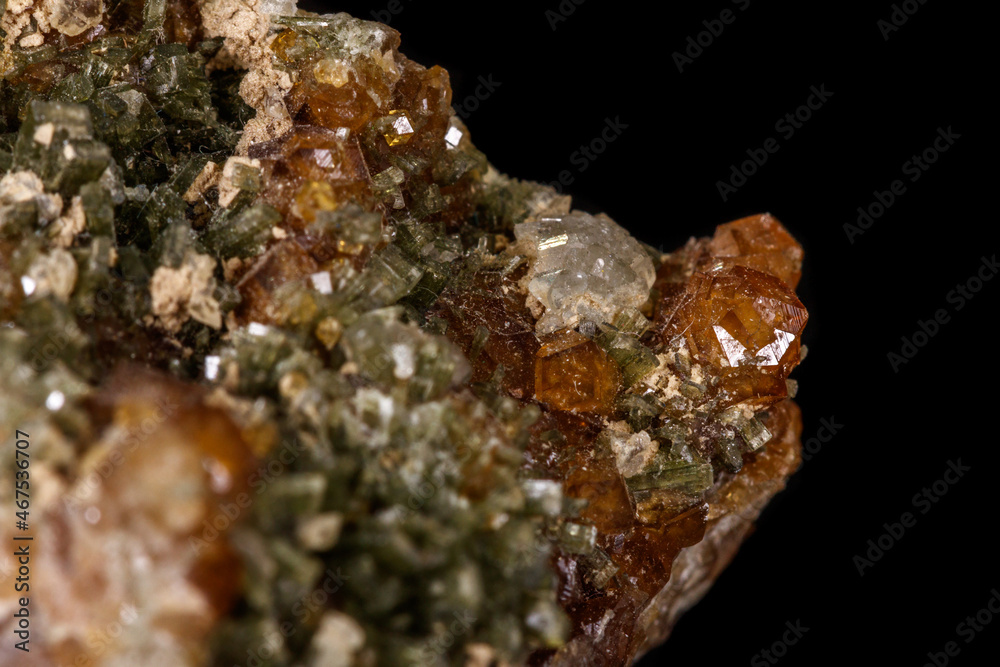 macro mineral stone Grossular, Garnet, Epidote on a black background macro mineral stone Grossular, Garnet, Epidote on a black background