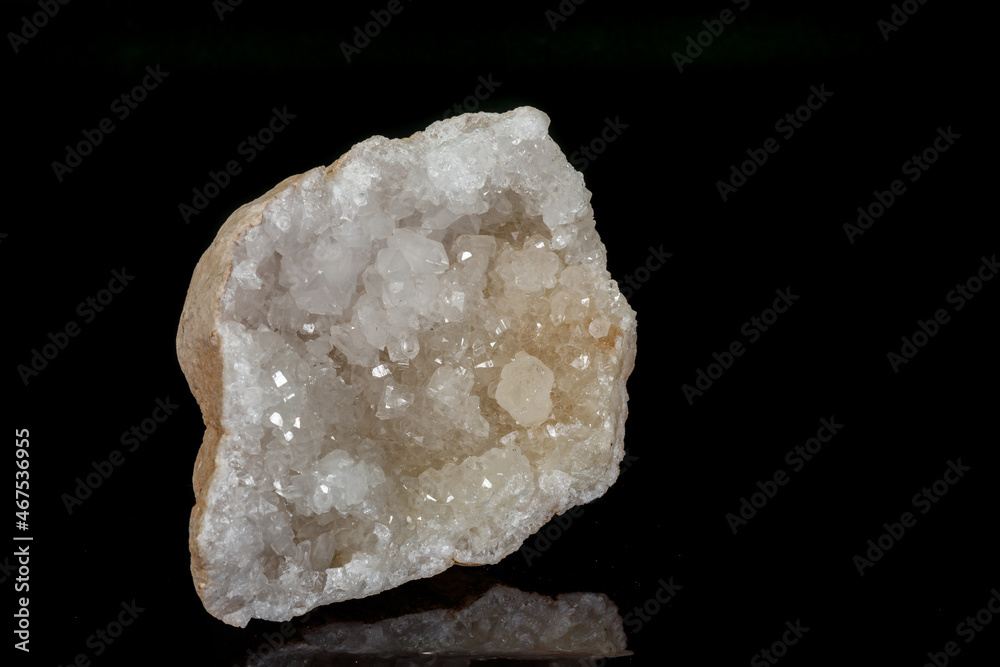 Macro mineral quartz snow stone on a black background