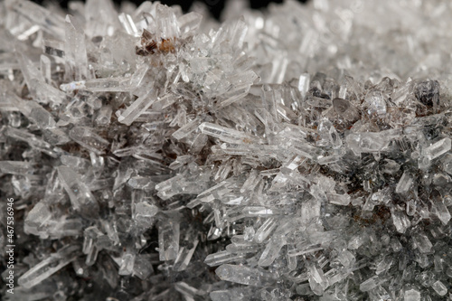 Macro mineral stone sulfite quartz on a black background