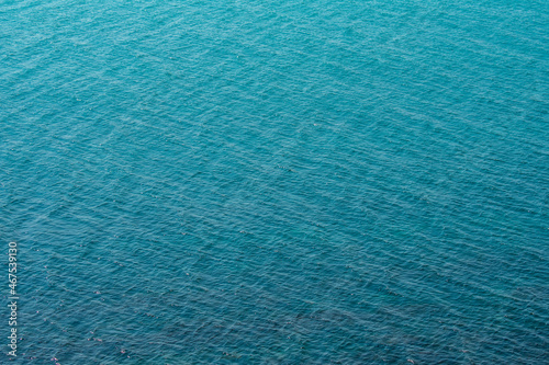 Blue background of the sea with waves