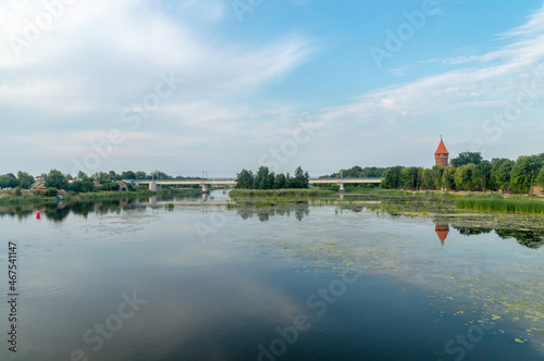 Nogat river with railway bridge in Malbork.