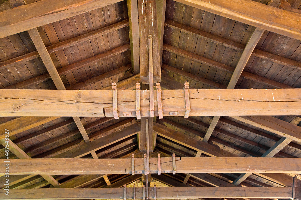 Old wooden truss structure called Palladian truss with beams and wooden roof Old wooden truss structure called Palladian truss with beams and wooden roof