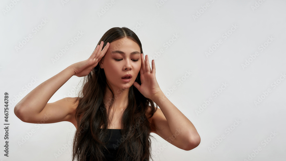 Young Asian woman look down at offer deal Young Asian woman look down at offer deal