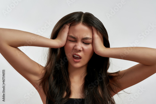 Sick Asian woman suffer from headache