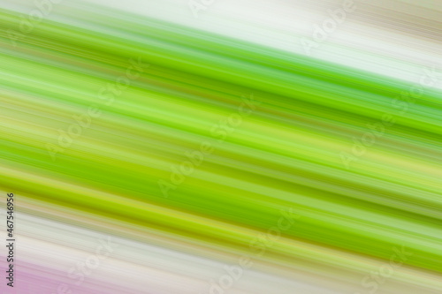 Descending horizontal wide green and yellow stripes. Light background