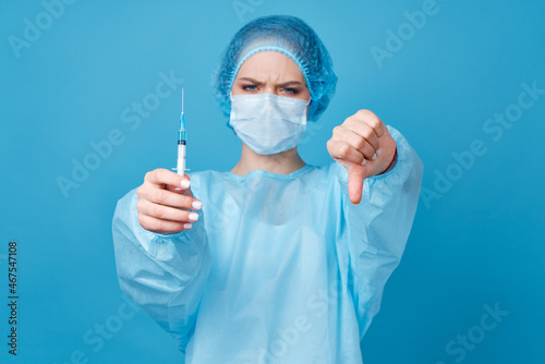 doctor in protective clothing treatment hospital blue background