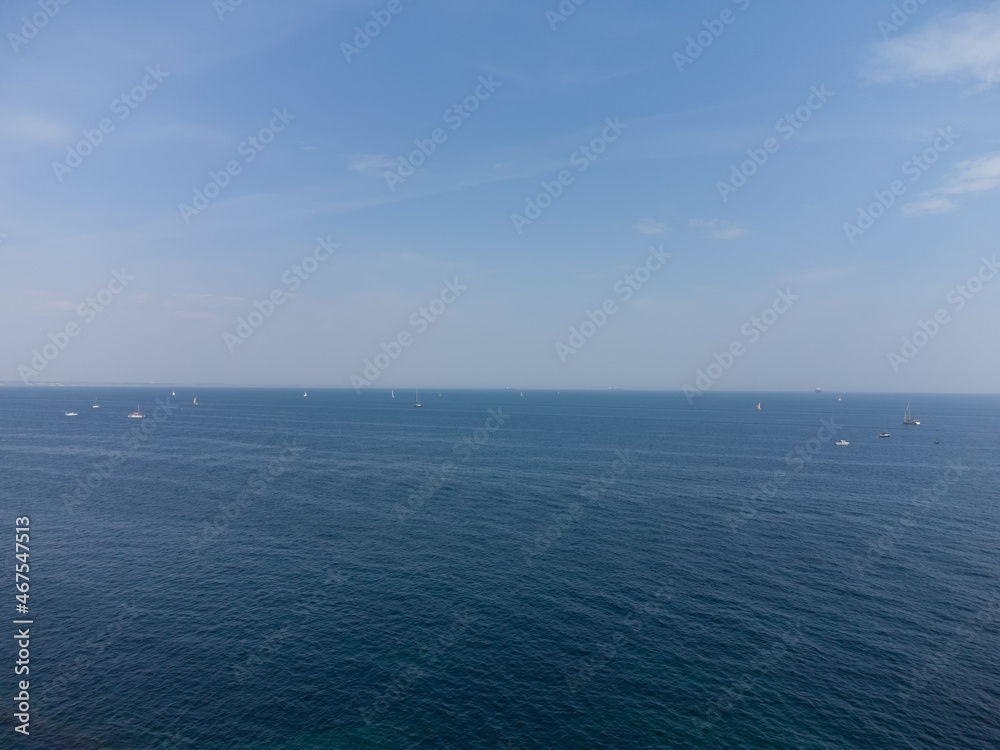 Blue horizon and blue sky in the sea, and many ships, boats and sailboats that are far out to sea. Blue horizon and blue sky in the sea, and many ships, boats and sailboats that are far out to sea.