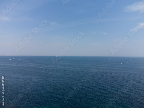 Blue horizon and blue sky in the sea, and many ships, boats and sailboats that are far out to sea. © malshak_off