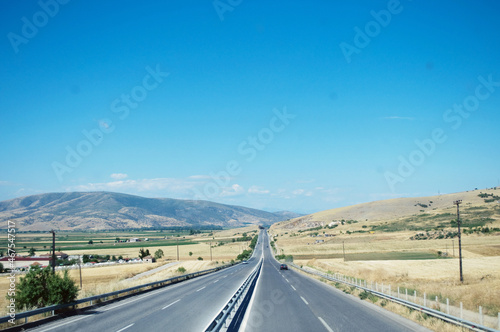 GREECE: Scenic landscape view with the road and mountains in the background 