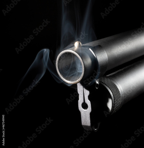 Barrel of a shotgun smoking