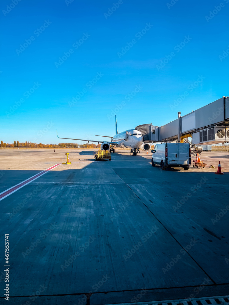 Airplane at the airport in the parking lot before departure Airplane at the airport in the parking lot before departure
