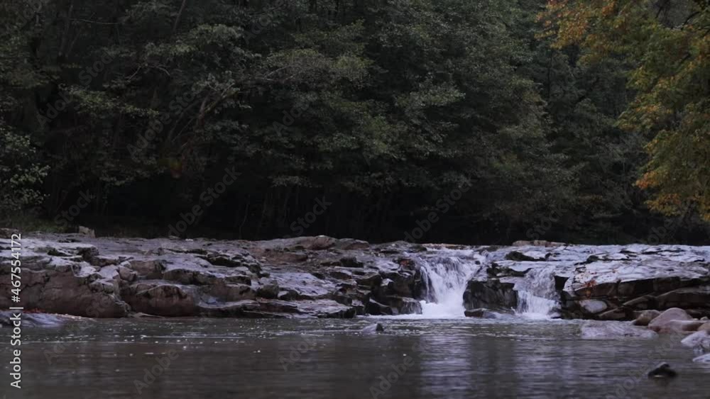 Waterfall in the forest. Static shot Nature background Peaceful And Calming nature. Zen Concept Waterfall in the forest. Static shot Nature background Peaceful And Calming nature. Zen Concept
