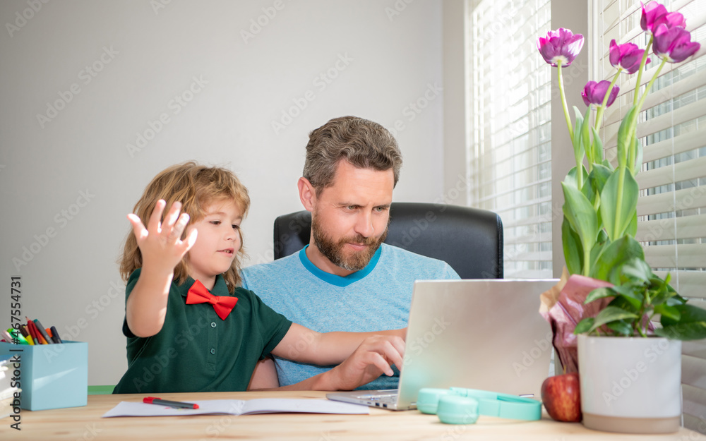 bearded dad or school private tutor teaching boy son with modern laptop, e-learning bearded dad or school private tutor teaching boy son with modern laptop, e-learning