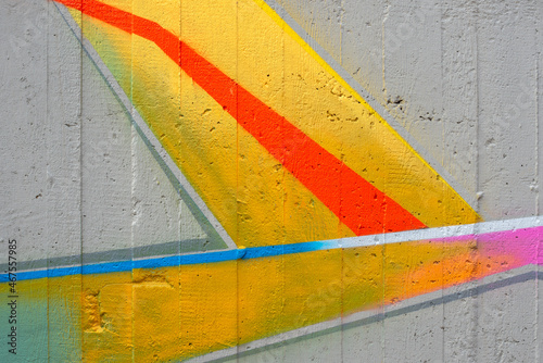 A concrete wall with vivid colored lines