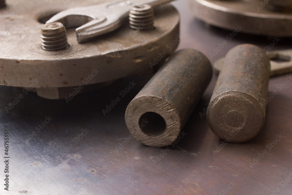 Old hand tools ,Pliers screwdriver wrench rusted iron metal tools on Steel plate at garage Old hand tools ,Pliers screwdriver wrench rusted iron metal tools on Steel plate at garage