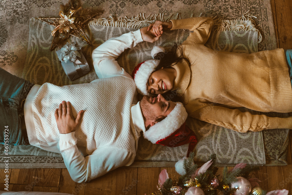 Cinematic image of a couple celebrating christmas at home.