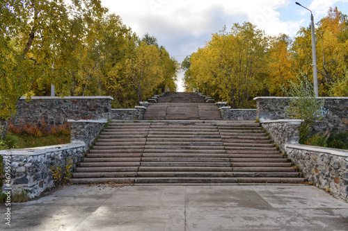 A staircase, as if going into the sky, in a park in the north of Russia.
