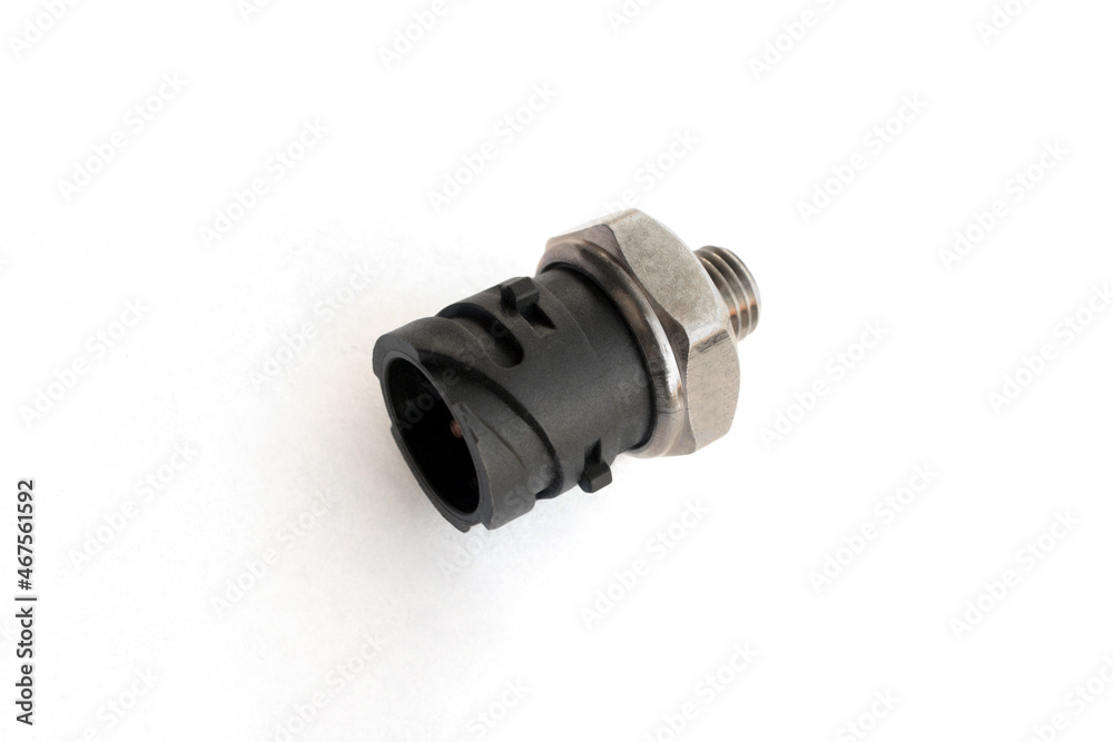 Oil pressure sensor of car isolated on white background. New spare parts. Oil pressure sensor of car isolated on white background. New spare parts.