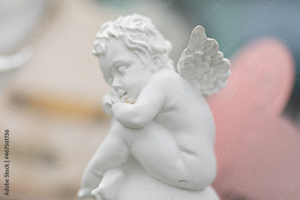 Angel sculptures on the gravestone in the cemetery Angel sculptures on the gravestone in the cemetery