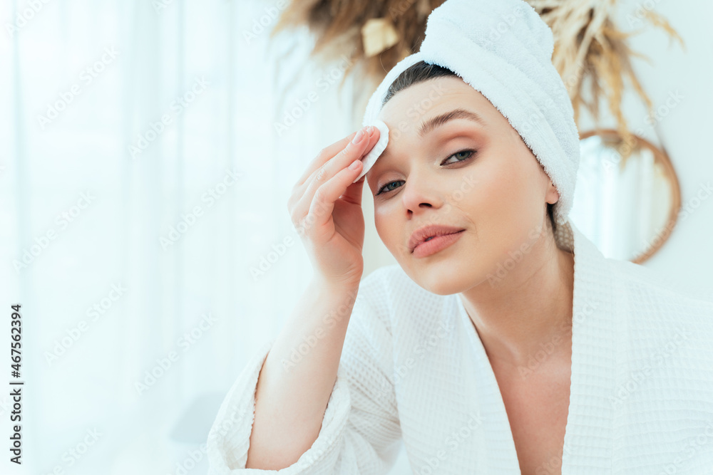 woman spending time in the bathroom taking care of herself