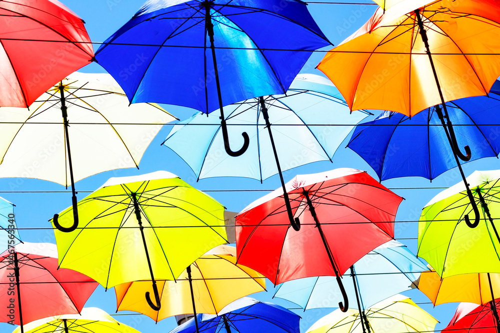 Avenue of color umbrellas. a lot of different umbrellas. Summer mood. Concept Good mood, positive. Avenue of color umbrellas. a lot of different umbrellas. Summer mood. Concept Good mood, positive.