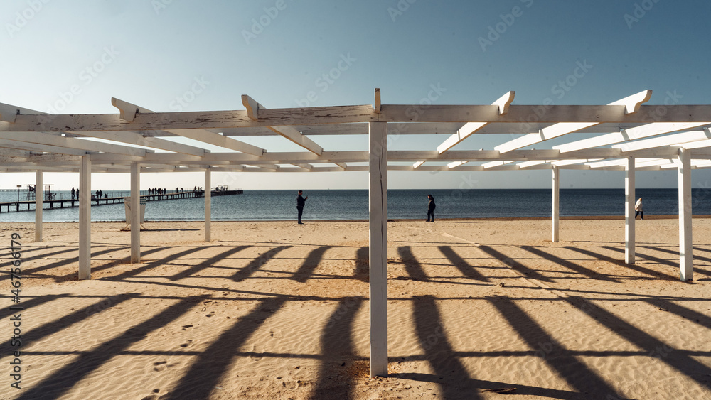 two people stand on the beach by the sea during quarantine two people stand on the beach by the sea during quarantine