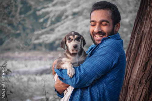 man with adorable street dog image - cute indian street dog images with man photo