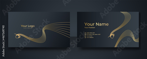 Modern Business Card - Creative and Clean Business Card Template. Luxury business card design template. Elegant dark back background with abstract golden wavy shapes lines shiny. Vector illustration