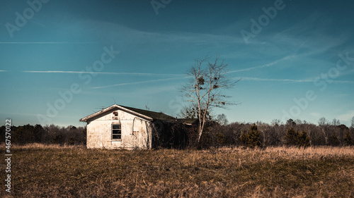 old rustic wooden house abandoned in the countryside