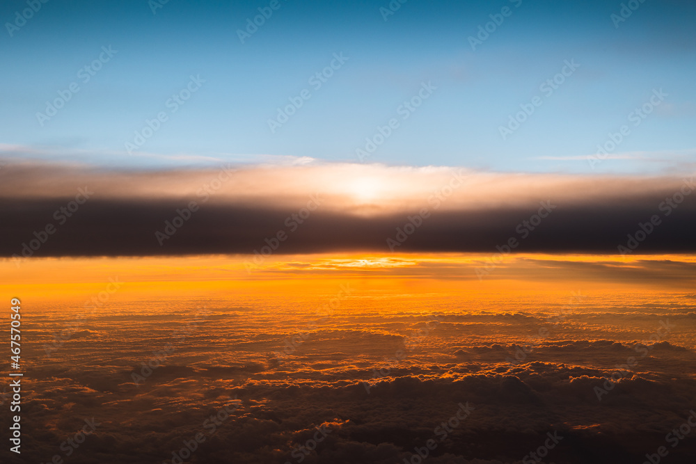 Spectacular view from the window of an airplane at sunset