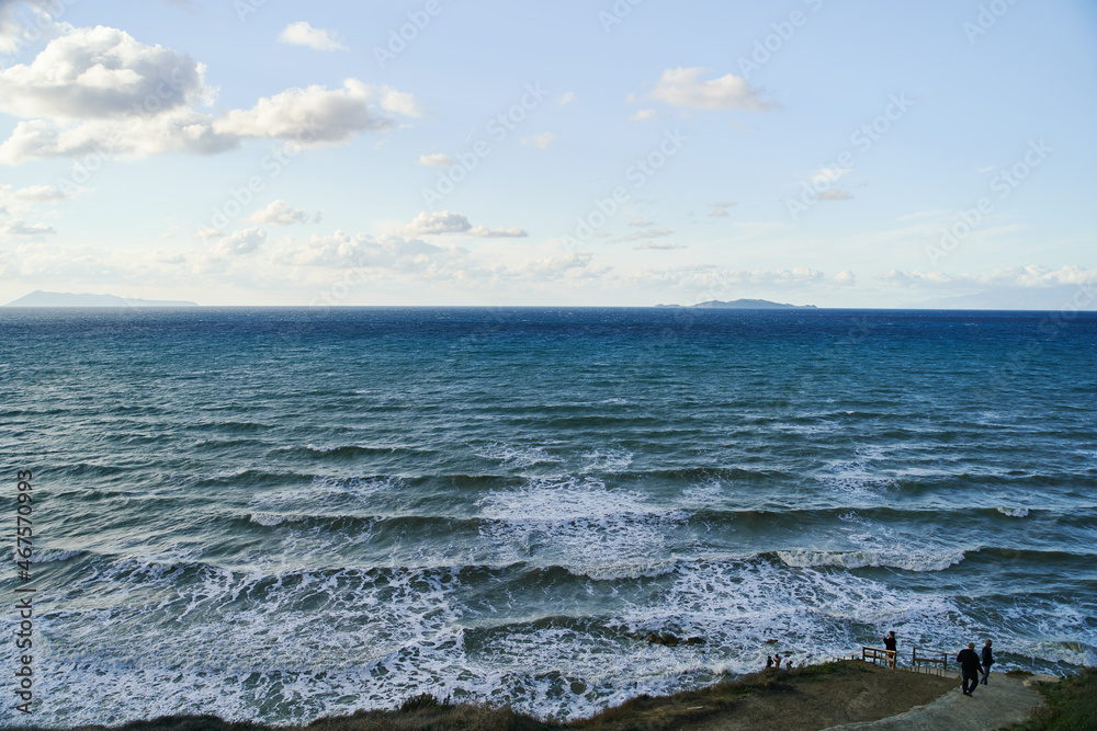 View of Logas Beach and the amazing rocky cliff in Peroulades. Corfu island. Greece View of Logas Beach and the amazing rocky cliff in Peroulades. Corfu island. Greece