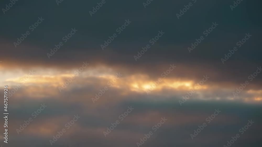 Dark huge cloud sky black stormy cloud motion big stormy rain day. Time lapse blue cloud. Storm giant moving fast movie time. A purposely blurry and over exposed image of a sunset Dark huge cloud sky black stormy cloud motion big stormy rain day. Time lapse blue cloud. Storm giant moving fast movie time. A purposely blurry and over exposed image of a sunset